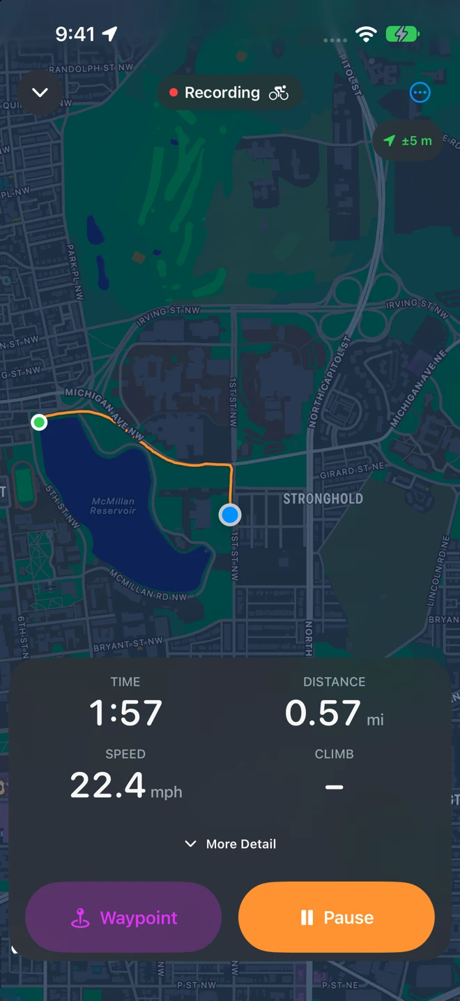Recording a ride on iPhone: the Recording pill at the top, ±5 m beside it, the orange track from the green start dot to the blue location dot, the panel with Time 1:57, Distance 0.57 mi, Speed 22.4 mph and Climb, and the Waypoint and Pause buttons